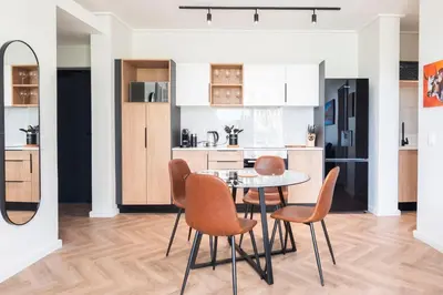 a kitchen and dining room with a table and chairs at Century City Natures Treat in Cape Town