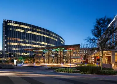 a large glass building with a street in front of it at On Park - Century City Lux Studio Apartment in Cape Town