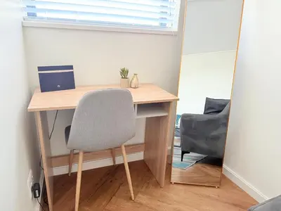 a desk with a chair and a computer on it at Luxe Studio - On Park near Canal walk Century City in Cape Town