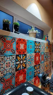 a colorful tile wall with flowers and plants on it at Beach Pebble - 200m walk to beach kite surfer paradise, work friendly, pet friendly - must request in Bloubergstrand