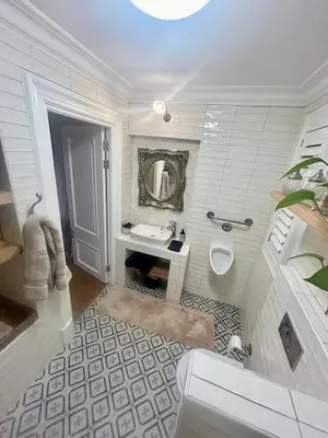 a white bathroom with a sink and a toilet at French Manor 1 in Stellenbosch