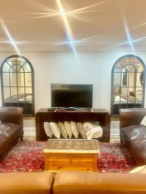 a living room with a couch and a table at French Manor 1 in Stellenbosch