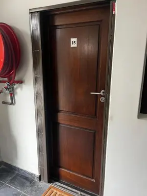a wooden door with the number on it at Live Like a Local in Stellies - By ARPA Hospitalities in Stellenbosch