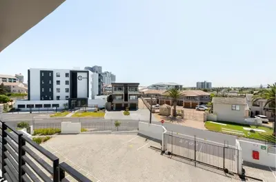 a view of a city from a balcony at Beautiful Beach Break! in Cape Town