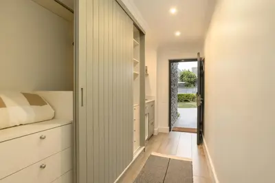 a hallway of a house with a bedroom and a door at Jonker Estate - Serene stay on Helshoogte Pass in Stellenbosch