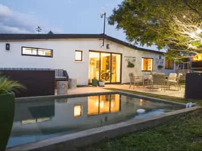 a house with a swimming pool in the yard at Lagoon Haven House in Hermanus
