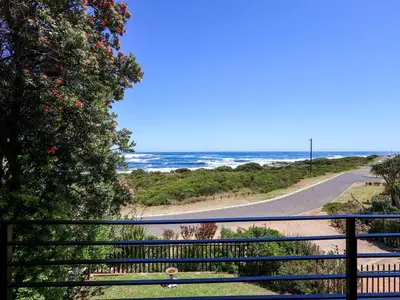 a view of the ocean from a balcony at Imoyo Ocean Retreat in Hermanus