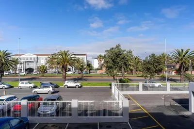 a parking lot with cars parked in a parking lot at South Views 14 in Cape Town