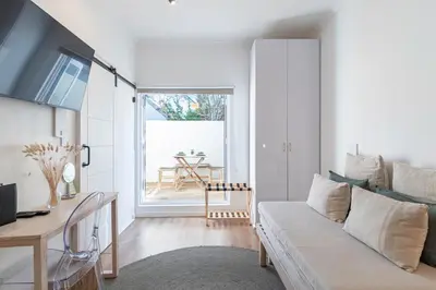 a living room with a couch and a table at 107 Dorpstraat Boutique Hotel in Stellenbosch