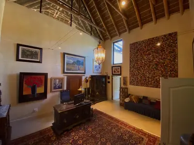 a large living room with a couch and a table at The Welgemoed Guest House in Bellville