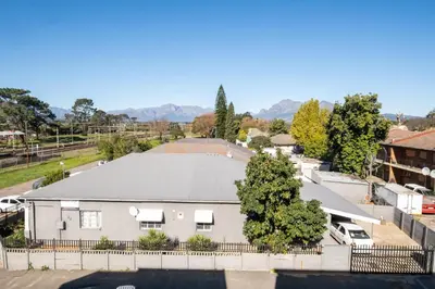 an aerial view of a white house at Paarl 225 - Lux Modern 2 Bedroom Apartment with Parking in Paarl