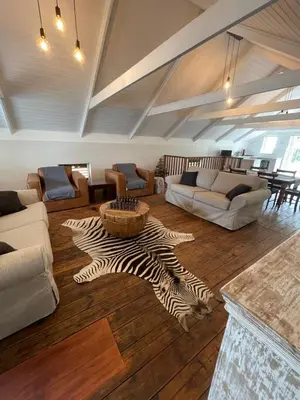 a living room with a zebra rug on the floor at Stay At Nantes in Paarl
