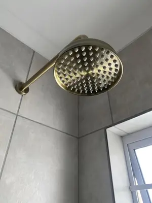 a shower head hanging from the ceiling of a bathroom at The Perfect Spot in Welgelegen