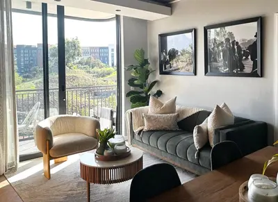 a living room with a couch and a table at ON PARK 317 LUXURY APARTMENT CENTURY CiTY in Century City