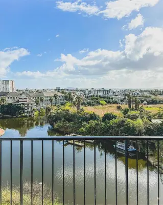a view of a river from a balcony at Modern One Bedroom Apartment Next to Canal Walk Mall in Cape Town