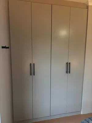a pair of white cabinets in a room at Apartment Paradys 2 - Serviced in Stellenbosch