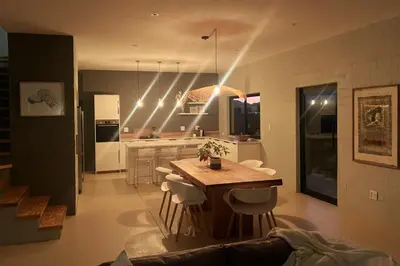 a kitchen with a table and a kitchen with lights at Lagoon & beach paradise in Lake Marina