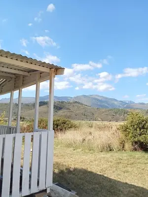 a porch with a view of the mountains at Cabin on Spinlea Farm Campsite in Caledon