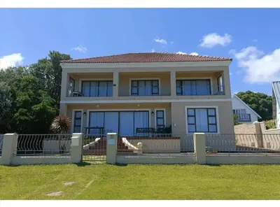 a house with a fence in front of it at Beautifully Sea View Escape Vermont 5 bedrooms in Hermanus