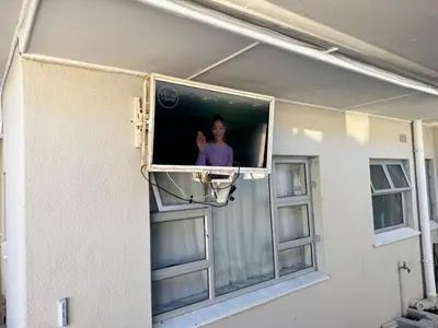 a television on the side of a house at Ewanges holiday home in Windsor Park