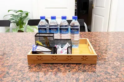 a crate of water bottles sitting on a table at Serena Inn Apartment 6 Self Catering in Cape Town