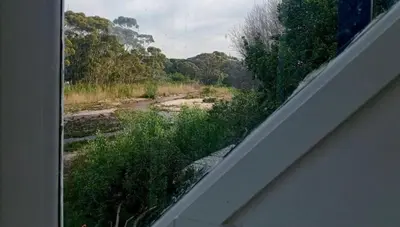 a view of a river from a window of a house at Studio at Providence in Hermanus