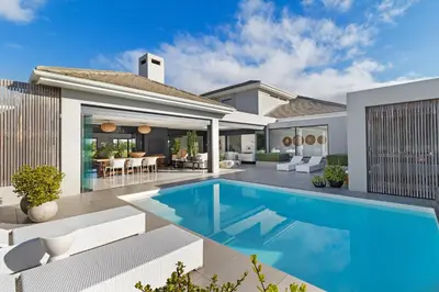 an image of a house with a swimming pool at Sunset Fairway Vista Villa in Cape Town