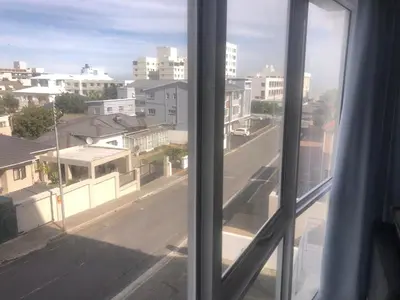 a view of a city street from a window at Palmsbeach 5 in Strand