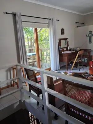 a view of a living room with a sliding glass door at Apple Pie Self-catering in Hermanus
