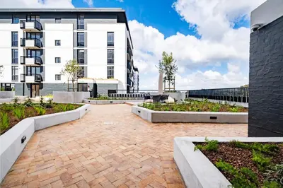 a courtyard in front of a building at Riverlands - Lux 1 bedroom Apartment with Parking in Cape Town
