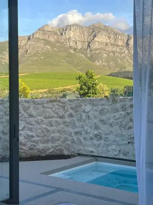 a view of a mountain from a window with a pool at Mountain View in Stellenbosch