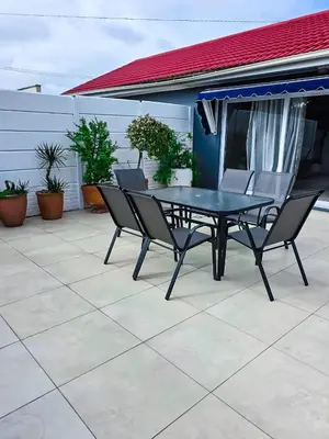 a black table and chairs on a patio at Elianta House in Cape Town