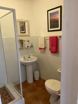 a bathroom with a sink and a toilet at Sea and Sky Rooiels in Rooiels