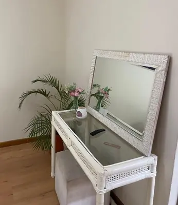 a white dressing table with a mirror on it at Sea and Sky Rooiels in Rooiels
