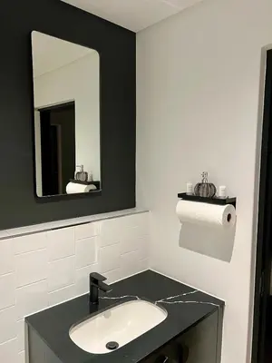 a bathroom with a sink and a mirror at The CoziPlace Lux in Cape Town