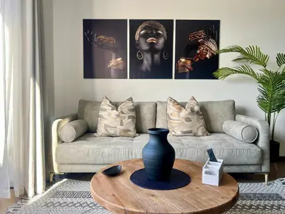 a living room with a couch and a table at The CoziPlace Lux in Cape Town