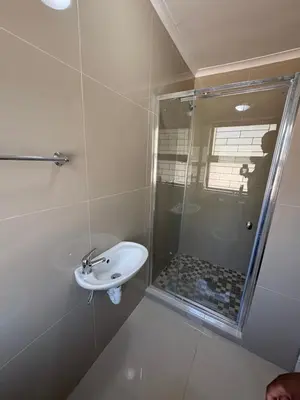 a bathroom with a sink and a shower at Joy House in Cape Town