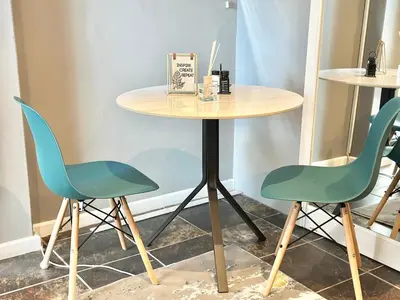 a table and two chairs sitting next to a table at Apartment in Bellville - self-catering in Bellville