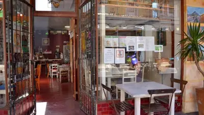 a restaurant with tables and chairs in a room at Obs Centre The Lookout in Cape Town
