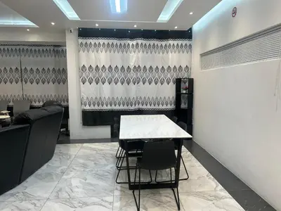 a dining room with a table and some chairs at Jorash Guesthouse in Cape Town