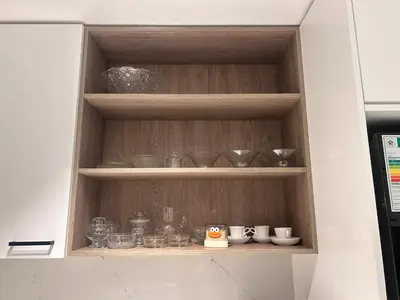 a cabinet filled with bowls and other glass items at Jorash Guesthouse in Cape Town