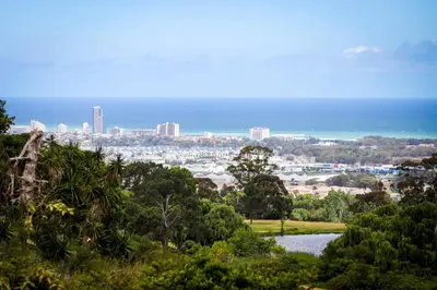 a view of a city from a hill with a lake at Winelands Villa Guesthouse and Cottages in Somerset West