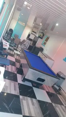 an office with a laptop computer on a checkered floor at Goodwood Neo & Ruks guest house in Goodwood