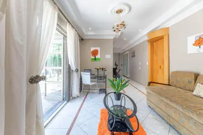 a living room with a couch and a table at TwinPalace in Plattekloof