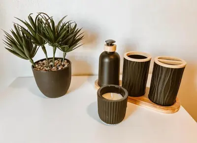 a table with two bottles and a potted plant at 4 Jooste Street in Windsor Park