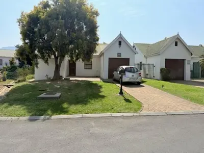 a white van parked in front of a house at Rose Garden, a Self-catering cottage in Worcester