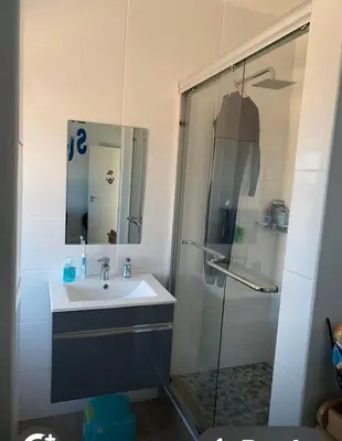 a bathroom with a sink and a shower at Western Cape in Cape Town