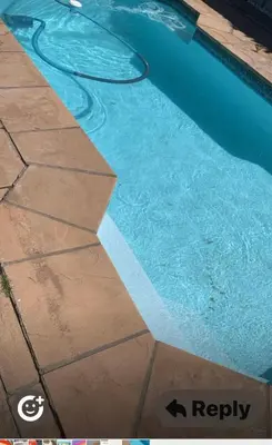 a swimming pool with a hose in the water at Western Cape in Cape Town