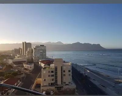 an aerial view of a city and the ocean at A little heaven in Strand