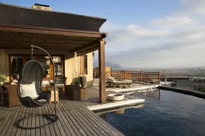 a house with a swimming pool on a roof at 43 On Sandstone in Somerset West